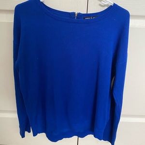 blue sweater with gold zipper